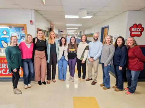 10 Waterloo teachers standing together smiling